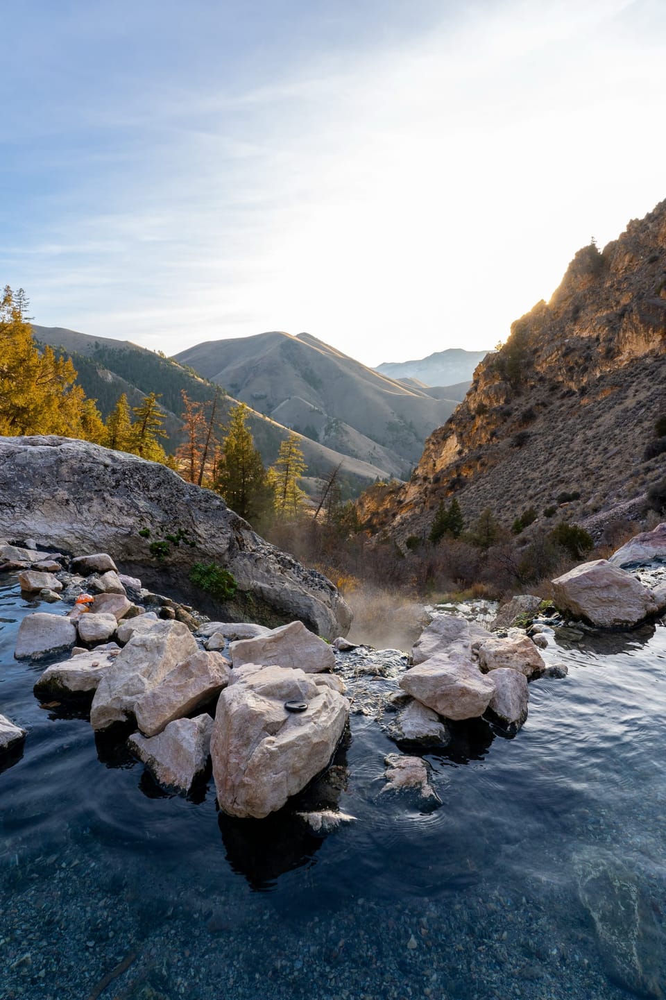 Mountain creek tumbling over boulders in a steep valley