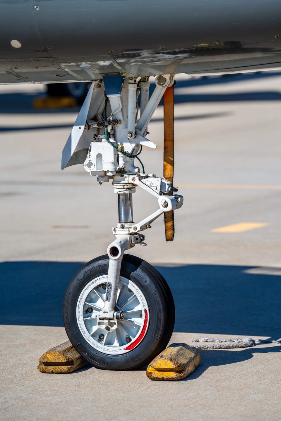 Close-up of a fighter jet's front landing gear