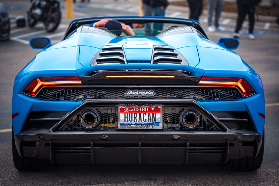 Rear view of a blue Lamborghini Huracan
